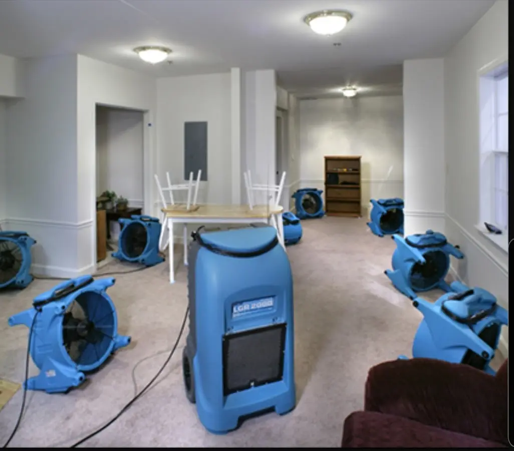Air movers and dehumidifier setup for Water Damage Restoration in Allendale